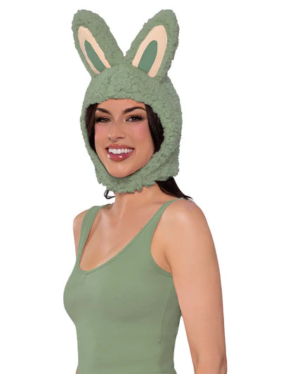 Woman wearing a green bunny hat on a white background