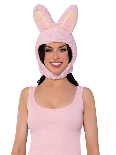 Woman wearing a pink bunny hat on a white background
