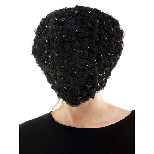 Black beaded headpiece worn by a person on a white background