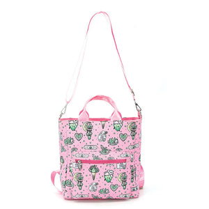 Pink tote bag with green pattern on a white background