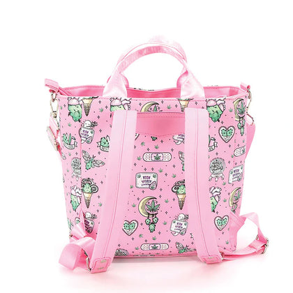 Pink tote bag with green and white designs on a white background