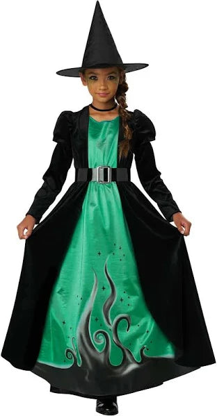 Child's witch costume with green dress and black cloak on a white background