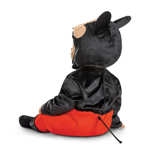 Child wearing a black and orange costume on a white background