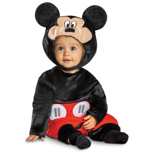 Baby wearing a Mickey Mouse costume on a white background