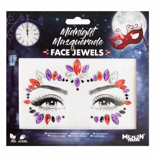 Packaged face jewels with colorful gemstones on a dark background with a clock and mask.
