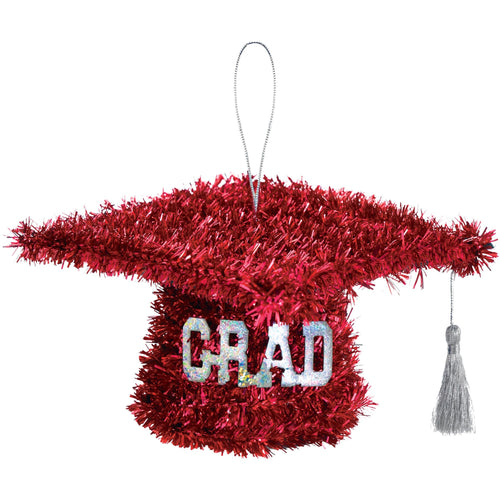 Red tinsel graduation cap ornament with 'GRAD' text on a white background