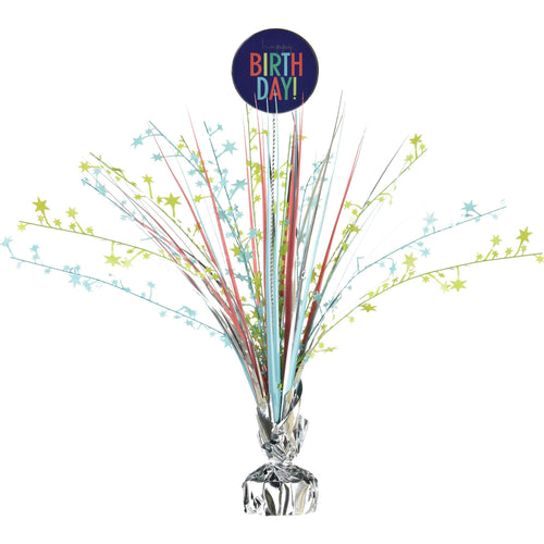 Decorative birthday centerpiece with multicolored streamers and 'Birthday!' balloon on a white background