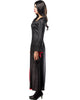 Woman wearing a long black dress with red accents on a white background