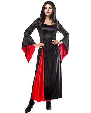 Woman wearing a black and red dress with bell sleeves on a white background