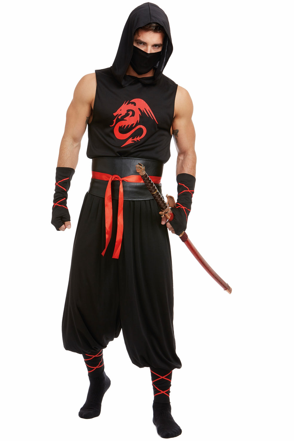 A man modeling a black ninja costume with a red dragon graphic on the chest, a red sash, black arm warmers, and a black face mask, holding a toy sword against a white background.