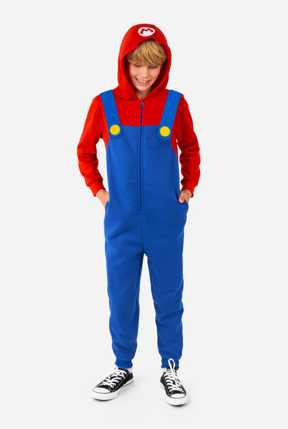 Person wearing a red and blue onesie with a hood on a white background