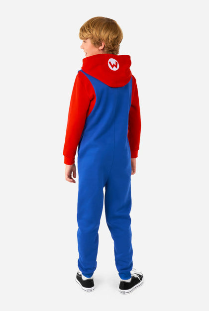 Child wearing a red and blue onesie with a hood on a white background