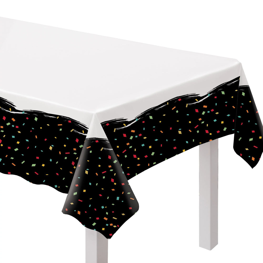 Black confetti tablecloth on a white table