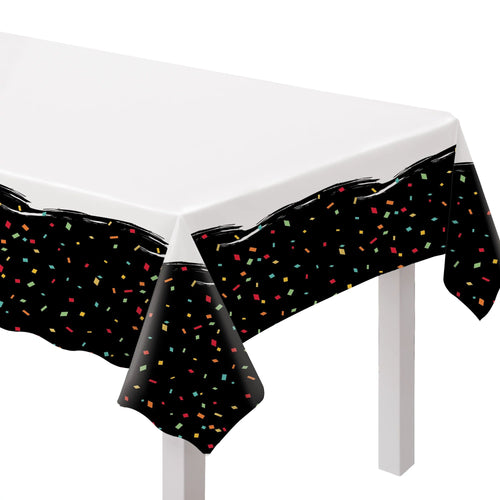 Black confetti tablecloth on a white table