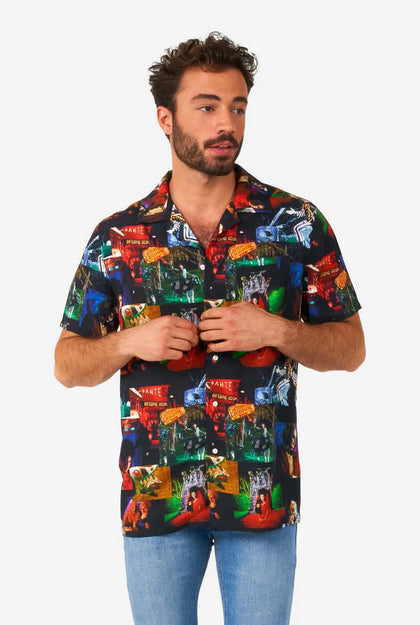 Man wearing a colorful patterned shirt on a white background