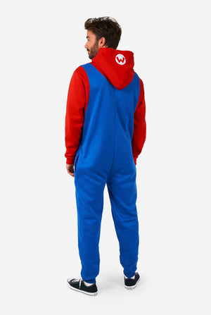 Person wearing a blue and red onesie with a hood on a white background