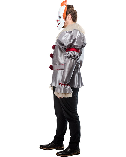Person wearing a silver clown costume with red accents on a white background