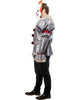 Person wearing a silver clown costume with red accents on a white background