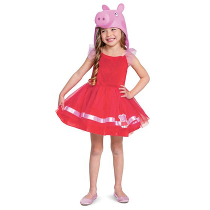 Child wearing a red dress with a pink pig hat on a white background