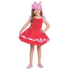 Child wearing a red dress with a pink pig hat on a white background