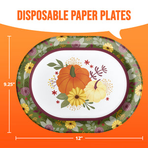 An oval disposable paper plate with a fall harvest design, featuring orange and yellow pumpkins, yellow flowers, and green leaves on a patterned border. The plate is shown against an orange background with white dimension lines indicating a 12-inch width and 9.