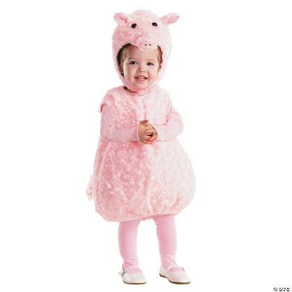Child wearing a pink pig costume on a white background