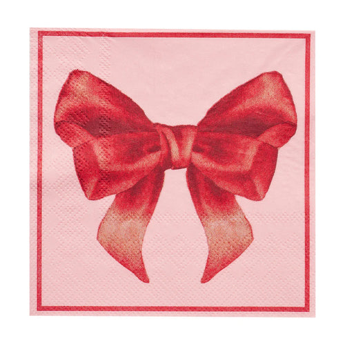Napkin with a red bow design on a pink background