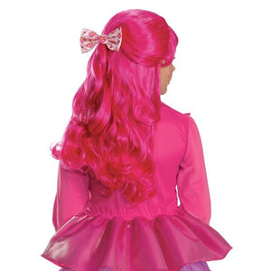 A bright pink wavy costume wig with a matching pink bow featuring a small floral pattern, modeled from the back on a child wearing a pink dress against a white background.