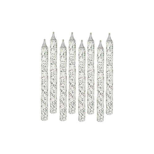 Set of silver glitter candles on a white background
