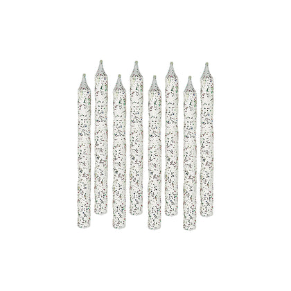 Set of silver glitter candles on a white background