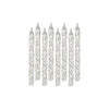Set of silver glitter candles on a white background