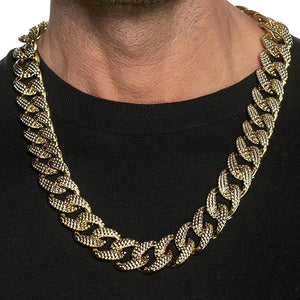 Gold chain necklace on a black background