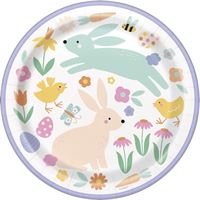 Decorative plate with rabbits, flowers, and Easter eggs on a white background