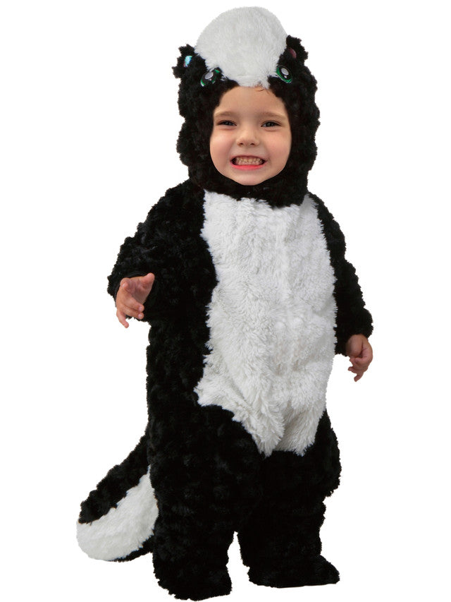 Child wearing a skunk costume on a white background