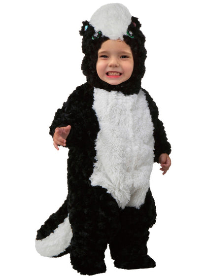 Child wearing a skunk costume on a white background