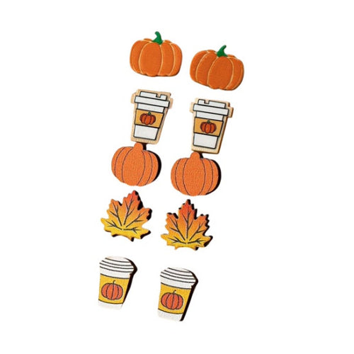 A set of autumn-themed wooden craft embellishments featuring orange pumpkins, yellow and orange maple leaves, and coffee cups with pumpkin designs, arranged on a plain white background.