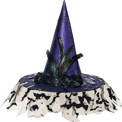 Purple witch hat with green feathers on a tablecloth with black cat designs.
