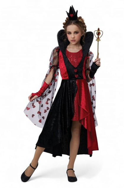 Child in a red and black costume with a wand on a white background