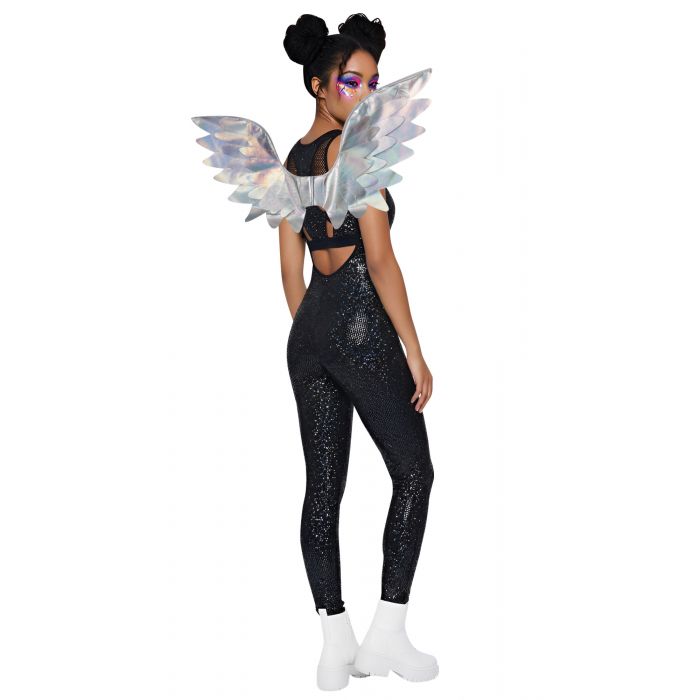 A woman modeling a black sequined bodysuit with a cutout back, large iridescent angel wings, and white ankle boots against a plain white background.