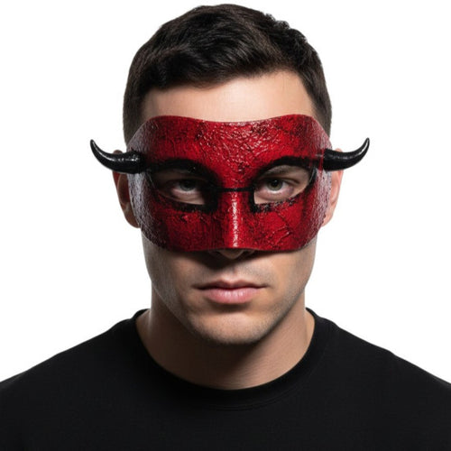 Person wearing a red mask with black horns on a white background