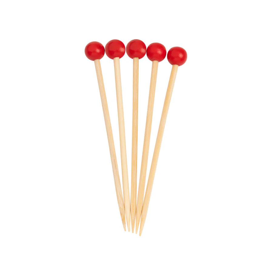 Set of six wooden skewers with red ends on a white background