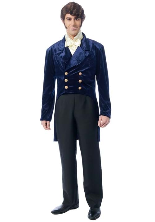 A man modeling a historical costume consisting of a navy blue velvet double-breasted waistcoat with gold buttons, black trousers, a white cravat, and a white waistcoat, on a solid white background.