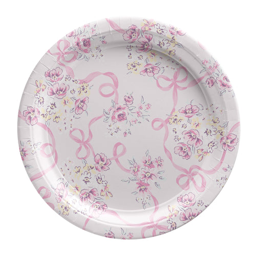 Paper plate with pink bows and floral patterns on a white background