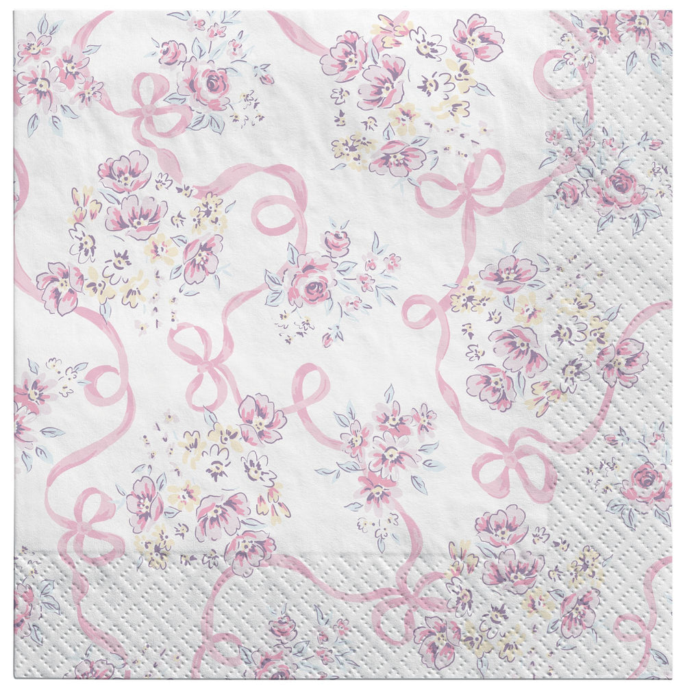 Napkin with pink floral design and ribbons on a white background