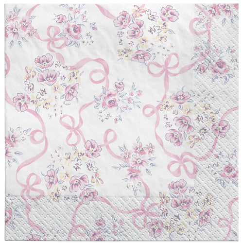 Napkin with pink floral design and ribbons on a white background