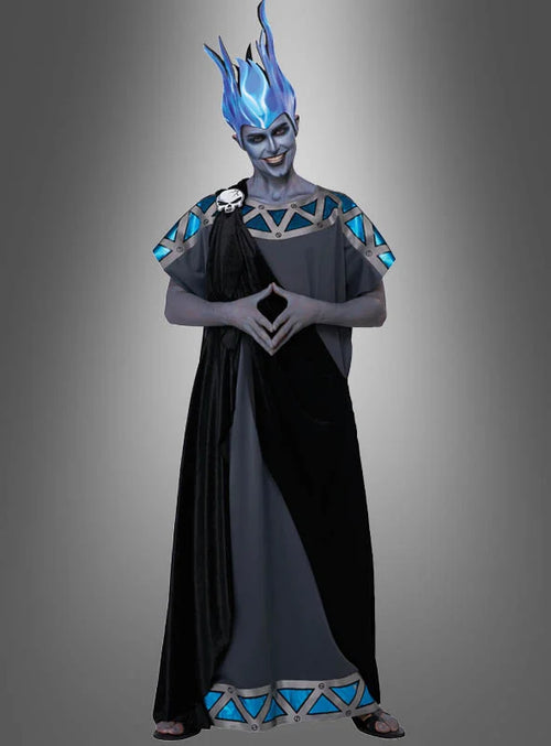 A person wearing a fantasy costume with a long black and dark gray dress, blue flame-like headpiece, and blue-and-silver geometric shoulder and hem details, standing against a gray gradient background.