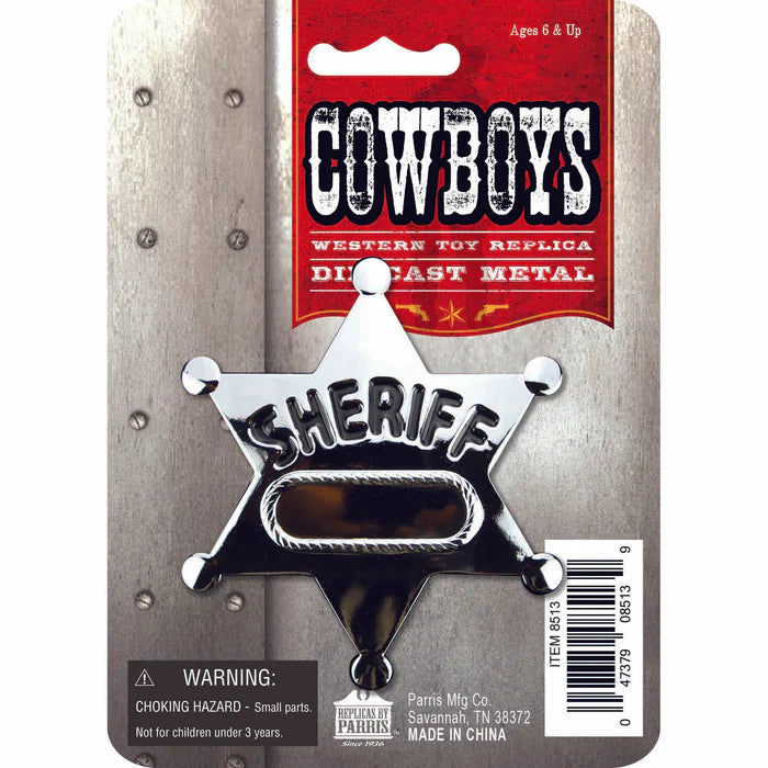 Metal sheriff's star badge on a packaging with 'Cowboys' branding.