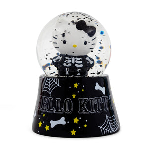 Hello Kitty skeleton snow globe with black and white design on a white background