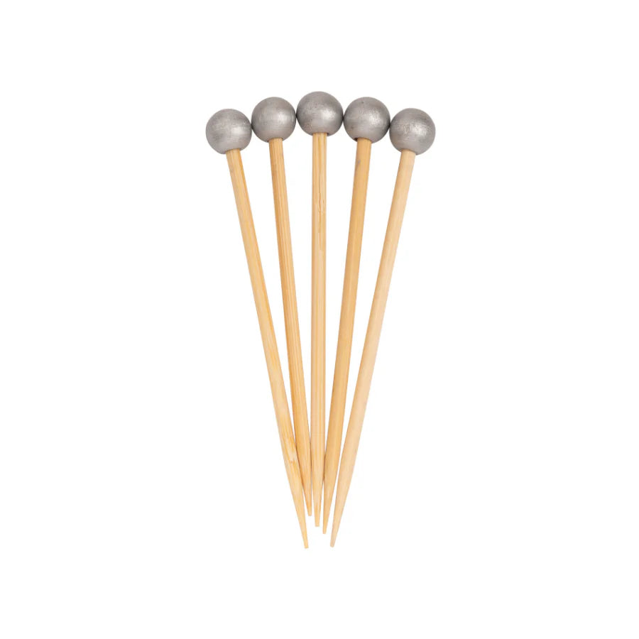 Five wooden toothpicks with metallic ends on a white background