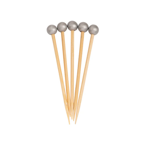 Five wooden toothpicks with metallic ends on a white background